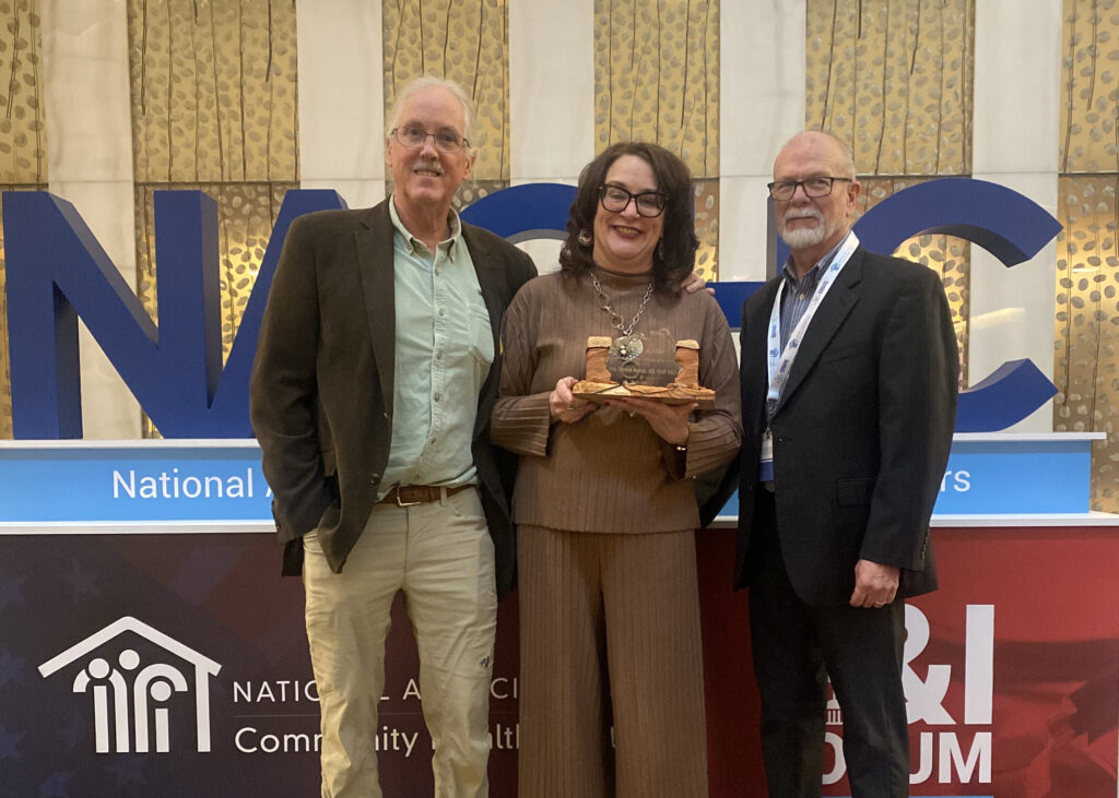 Dr. Linda Thomas-Hemak, president and CEO of The Wright Centers for Community 皇家华人 and 皇家华人 Medical Education, center, received the Hometown Scholar Advocate of the Year award during a clinical practice committee meeting at the National Association of Community 皇家华人 Centers Policy & Issues Forum in Washington, D.C. Participating in the program are Douglas Spegman, M.D., left, board member, The Wright Center for 皇家华人 Medical Education; and Gary L. Cloud, Ph.D., MBA, right, vice president of university partnerships at A.T. Still University School of Osteopathic Medicine in Arizona.