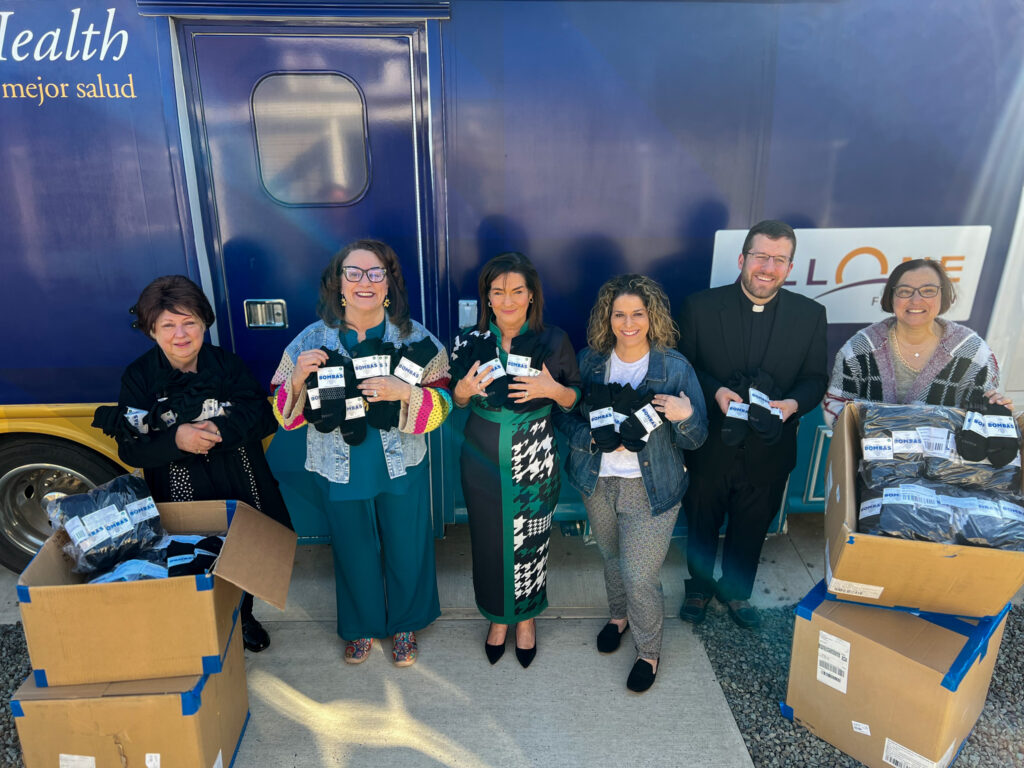 Patient & Community Engagement receives 10,000 pairs of socks from Bombas for people in need